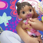 Baby Alive Baby Lil Sounds: Interactive Black Hair Baby Doll, Includes Dress and Pacifier - Image 2