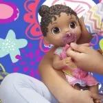 Baby Alive Baby Lil Sounds: Interactive Black Hair Baby Doll, Includes Dress and Pacifier - Image 2