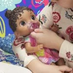 Baby Alive Baby Lil Sounds: Interactive Black Hair Baby Doll, Includes Dress and Pacifier - Image 4