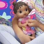 Baby Alive Baby Lil Sounds: Interactive Black Hair Baby Doll, Includes Dress and Pacifier - Image 6